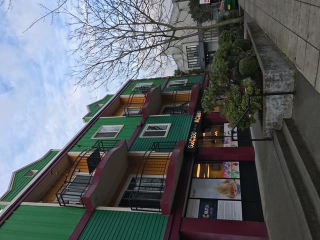 Colorful building featuring various restaurants and convenience stores, BLOCK 23.