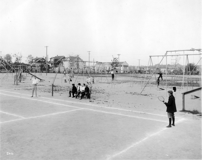 Boys playing tennis at University Playground