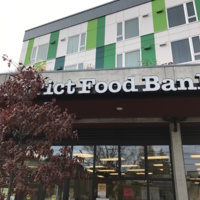 Photo of the University Food Bank and Nearby Apartment Building