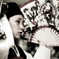 A young novice mudang, beginning an initiation ritual. A young novice mudang, beginning an initiation ritual.