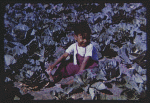 Image of a Child Sitting in a Spinach Field