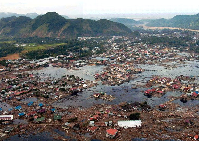 A picture taken by the US Navy of the destruction  along a village on Sumatra coast.  Image  credit: Reuters