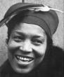Zora Neale Hurston with a feather in her hat